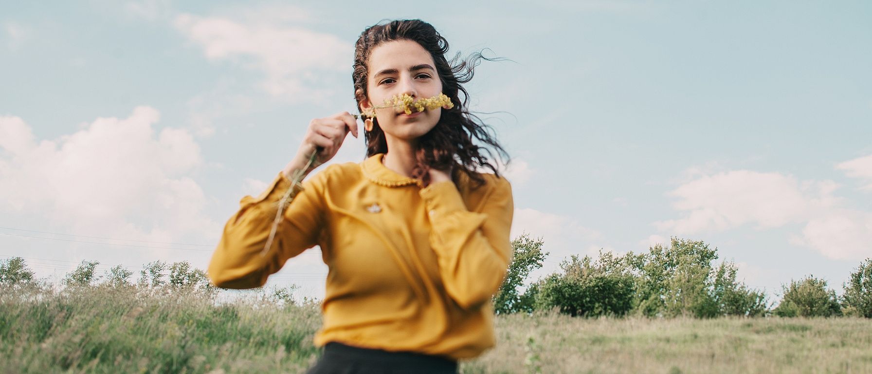 Woman smelling a flower