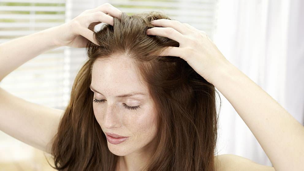 Woman touching her hair